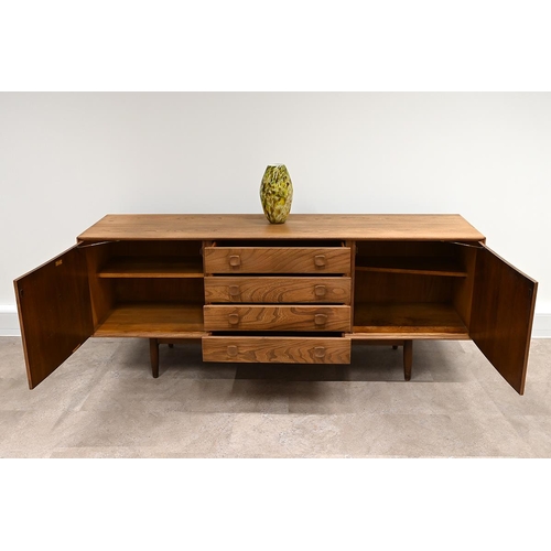 591 - An Ensign Elm sideboard by Bristow and Townsend comprising four long drawers flanked by cupboards wi... 