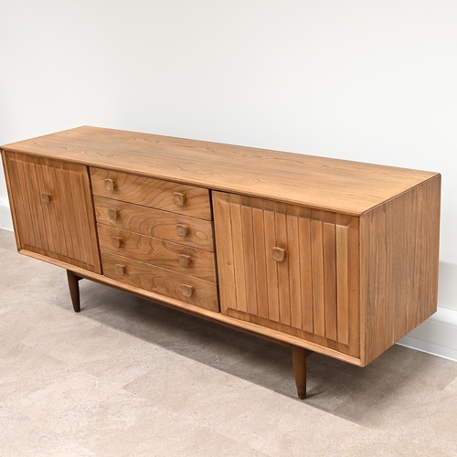 591 - An Ensign Elm sideboard by Bristow and Townsend comprising four long drawers flanked by cupboards wi... 