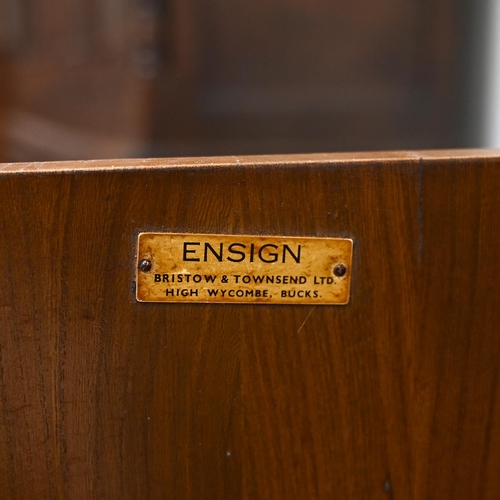 591 - An Ensign Elm sideboard by Bristow and Townsend comprising four long drawers flanked by cupboards wi... 