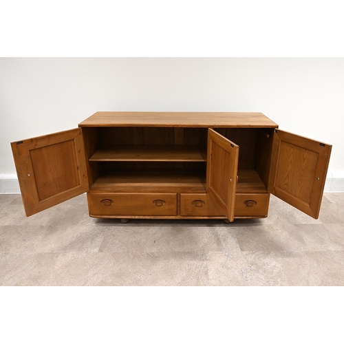 592 - Ercol Windsor light elm sideboard, fitted with three cupboards over two drawers all with carved oval... 