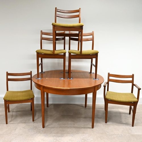 599 - 1970's circular teak dining table with fold out extension leaf  plus 5 chairs (one a carver) with pa... 