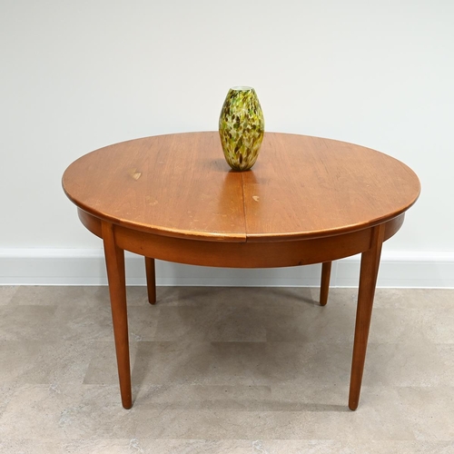 599 - 1970's circular teak dining table with fold out extension leaf  plus 5 chairs (one a carver) with pa... 