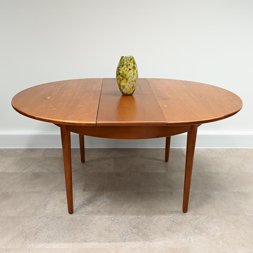 599 - 1970's circular teak dining table with fold out extension leaf  plus 5 chairs (one a carver) with pa... 