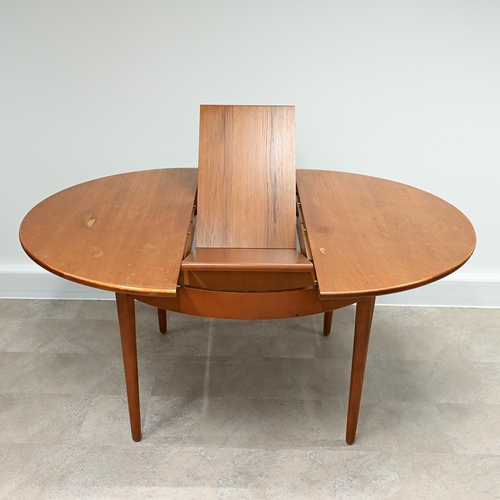 599 - 1970's circular teak dining table with fold out extension leaf  plus 5 chairs (one a carver) with pa... 