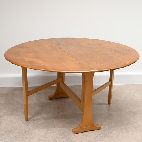 600 - A Mid-Century Ercol Blonde elm and beech Model 610 drop leaf Sutherland oval dining table. Part of t... 