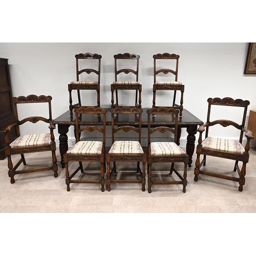 603 - Late Victorian carved oak extending dining table and eight chairs. The table with carved edge and he... 