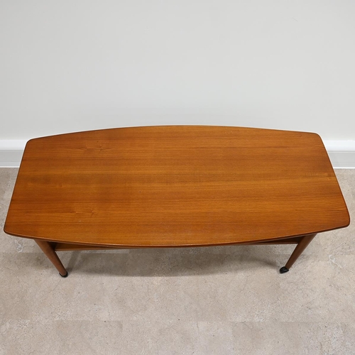 605 - Mid Century teak coffee table of rounded rectangular form with slatted magazine shelf under raised o... 