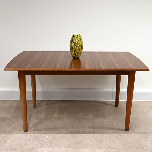 612 - A Mid-Century Gordon Russell for Heals teak extending dining table and 6 chairs (one of which is a c... 