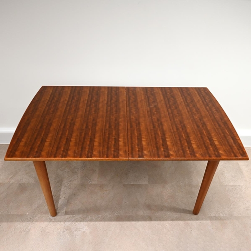 612 - A Mid-Century Gordon Russell for Heals teak extending dining table and 6 chairs (one of which is a c... 