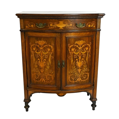 616 - An Edwardian bow-fronted rosewood cabinet with long drawer over two cupboard doors, all inlaid with ... 