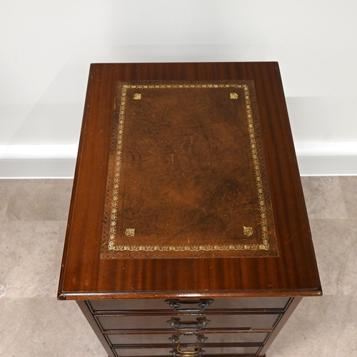 620 - Mahogany 2 drawer filing cabinet with tooled brown leather insert to top. The drawer fronts designed... 