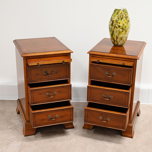 622 - A pair of Bradley yew wood bedside cabinets each with three drawers, with brass swan neck handles, a... 