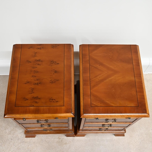 622 - A pair of Bradley yew wood bedside cabinets each with three drawers, with brass swan neck handles, a... 