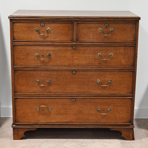 624 - A late Georgian Oak chest of 2 over 3 drawers with brass handles.  W 100cm, D 51cm, H 102cm.