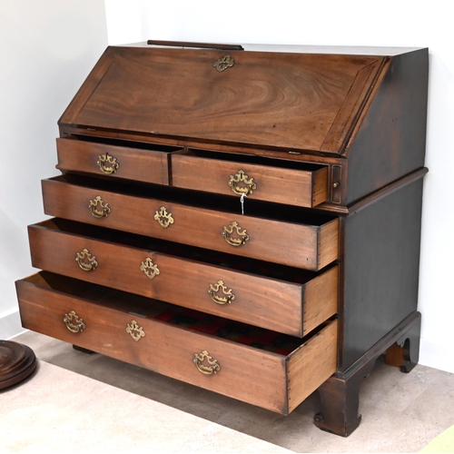 626 - A Georgian Mahogany Bureau of good proportions with original brass hardware. Internally it has a hid... 