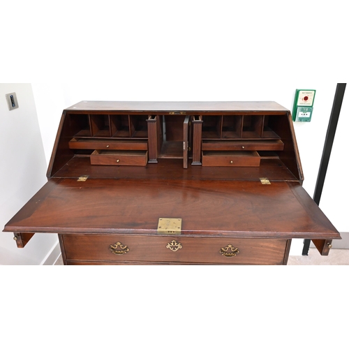 626 - A Georgian Mahogany Bureau of good proportions with original brass hardware. Internally it has a hid... 