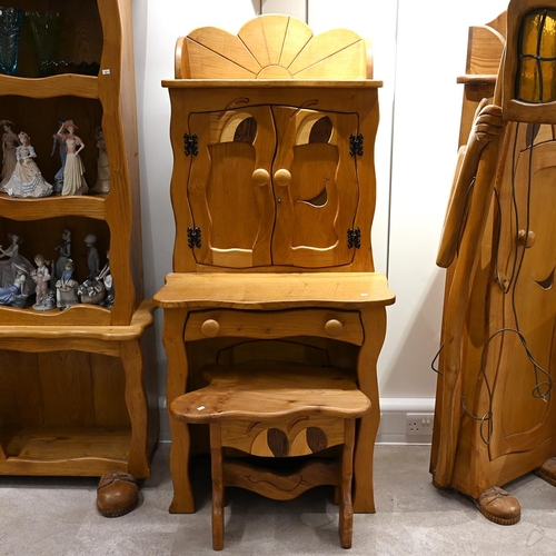 627 - Late 20th century carved oak character desk with stool. The desk with cabinets over with carved with... 