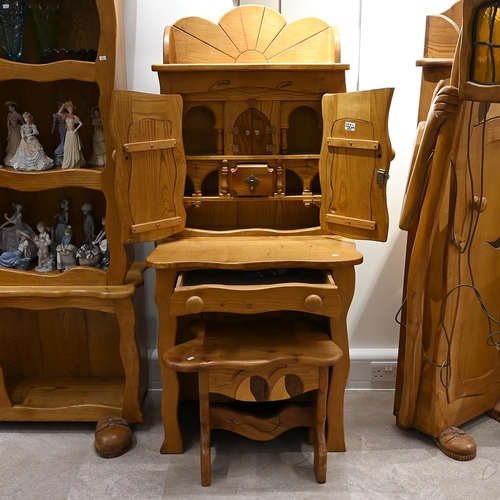 627 - Late 20th century carved oak character desk with stool. The desk with cabinets over with carved with... 