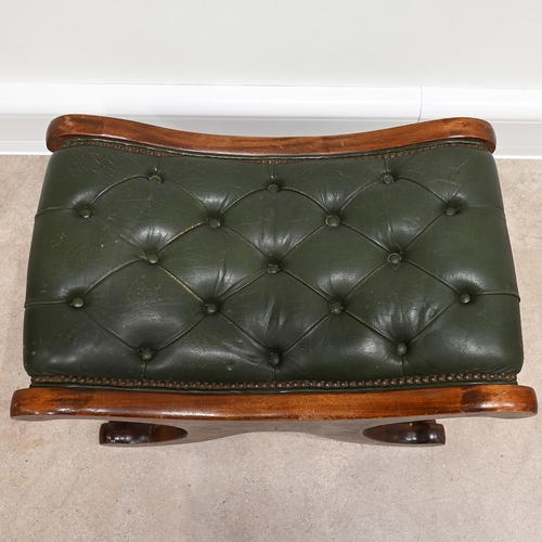 633 - A Saddle style footstool, in the manner of Chesterfield, with buttoned green leather top and mahogan... 