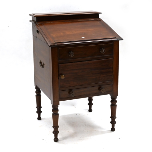 637 - A Victorian mahogany washstand with sloping top opening to reveal recesses for wash bowl and a brass... 