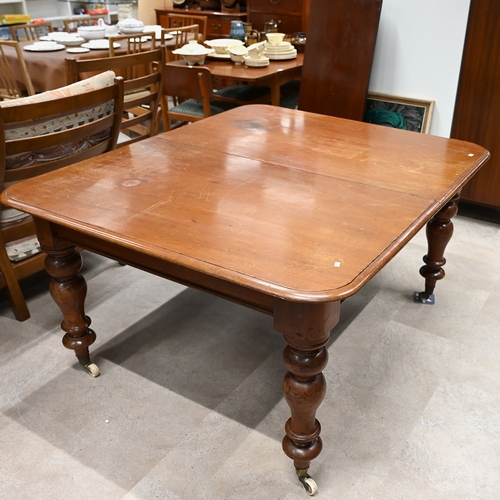 609 - Mid to late 19th century mahogany extending dining table raised on four baluster turned legs with ce... 