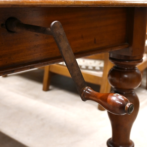 609 - Mid to late 19th century mahogany extending dining table raised on four baluster turned legs with ce... 