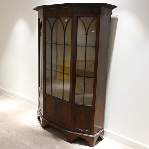 619 - Early 20th Century mahogany china display cabinet of canted form with carved splaying pediment over ... 