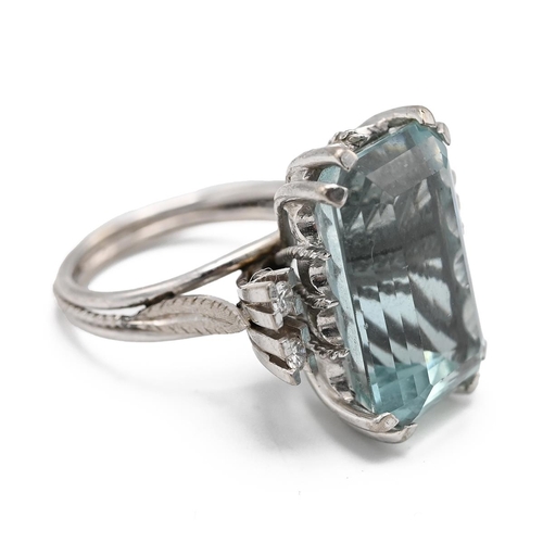 1 - A 15ct white gold aquamarine and diamond cocktail ring, the step cut aquamarine approximately 17mm x... 