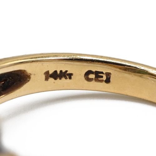 11 - A 14ct gold and emerald ring and diamond cluster ring, set with pear shaped emerald, finger size M 1... 