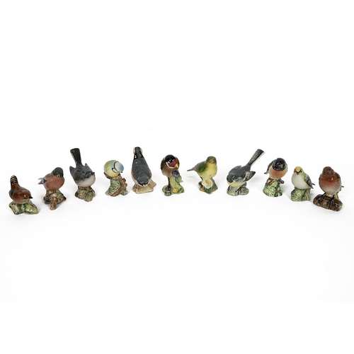 100 - Beswick porcelain birds - 11 in total including: Nuthatch (a/f), Greenfinch, Chaffinch, Stonechat, G... 