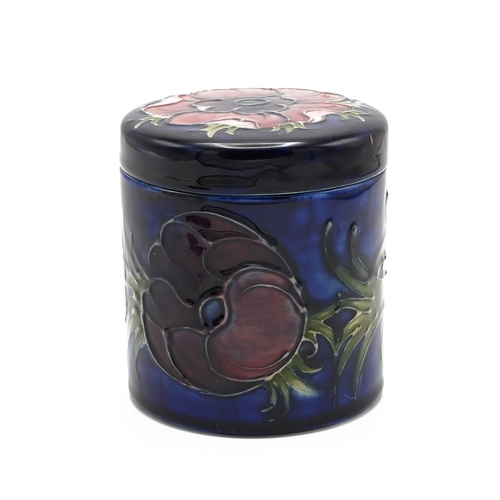 118 - Moorcroft Anemone on blue ground lidded pot, mid 20th century. Lid bears old repair. There is a spar... 