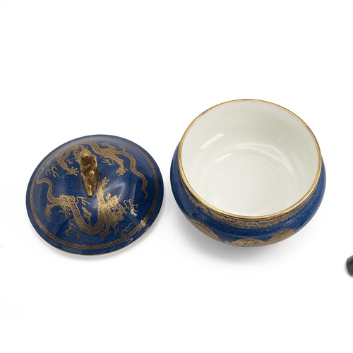 121 - Daisy Makeig Jones for Wedgwood Dragon Lustre powder bowl with cover in blue and gold, with Sibyl fi... 