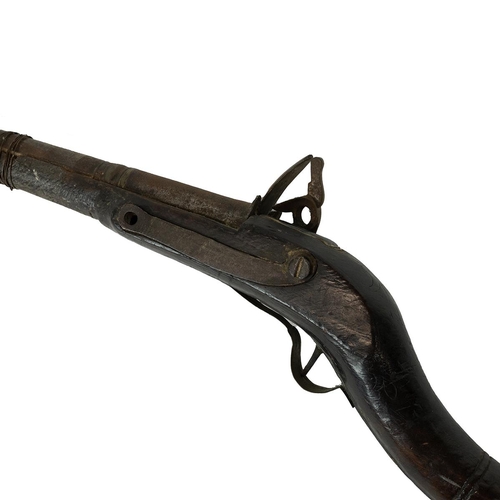 28 - 19th Century flintlock musket, the stock of oriental form, with ramrod, embedded George IV penny for... 