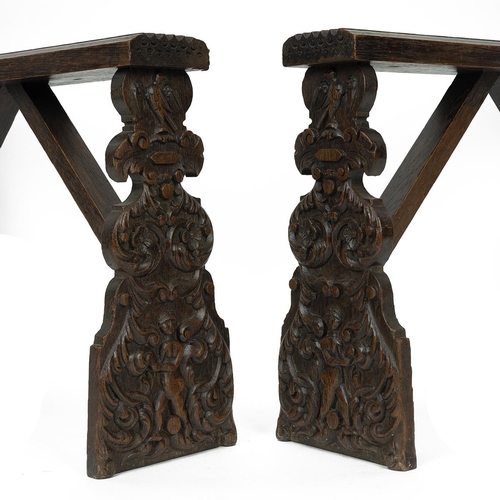 404 - Pair of oak Dutch 19th Century cabinet / 'coffin' stands. Carved front and rear supports with figure... 