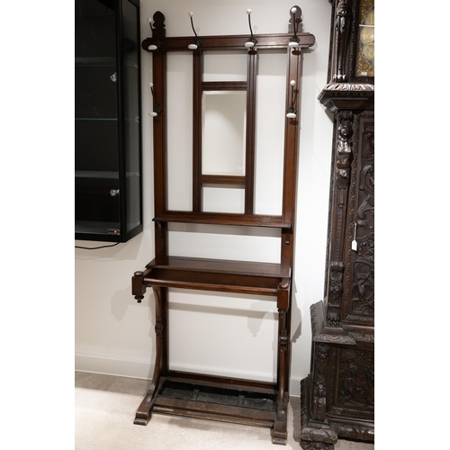 408 - 19th century Gothic Revival hall stand. Walnut construction with inset mirror, metal drip tray to ba... 