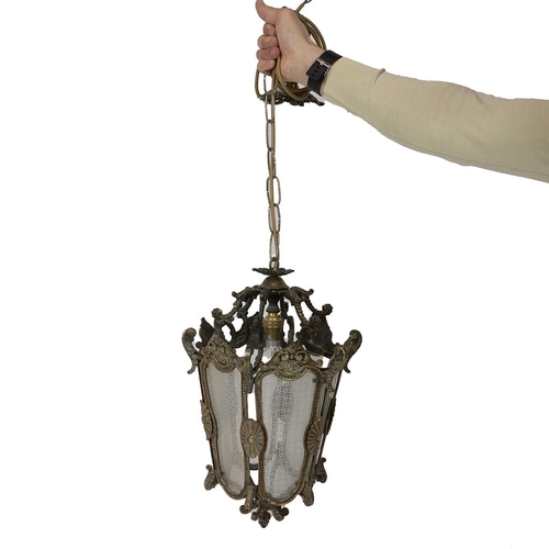 41 - A brass and glass early to mid 20th century ceiling lantern housing a single bulb the glass with an ... 