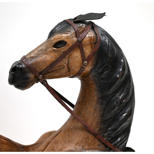 44 - Two decorative leather covered rearing horses in the manner of Liberty. Dimensions each: 85cm high x... 