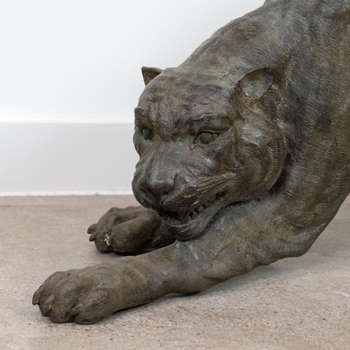 59 - A large and well executed bronze sculpture of a prowling wildcat (puma/tiger). Approximate dimension... 