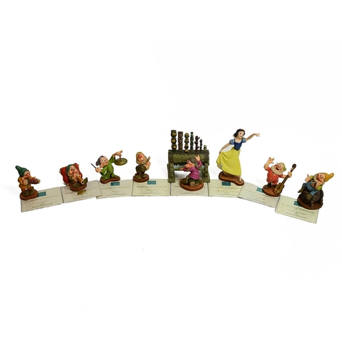 78 - Walt Disney's Snow White and the Seven Dwarfs, collection of porcelain figurines to include Snow Whi... 