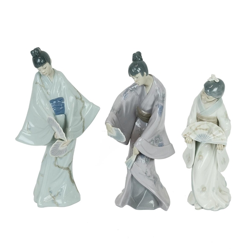 92 - Three Lladro Nao porcelain figurines of Geishas with fans, two dated 1990. one 1977. Heights 30cm, 2... 