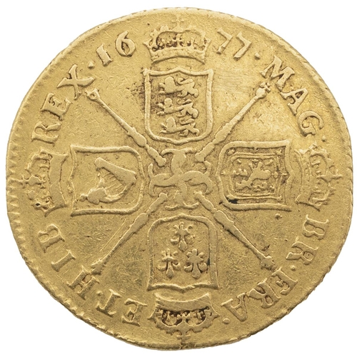 101 - 1677 King Charles II regular strike gold Guinea with fourth laureate bust (S 3344). Obverse: right-f... 