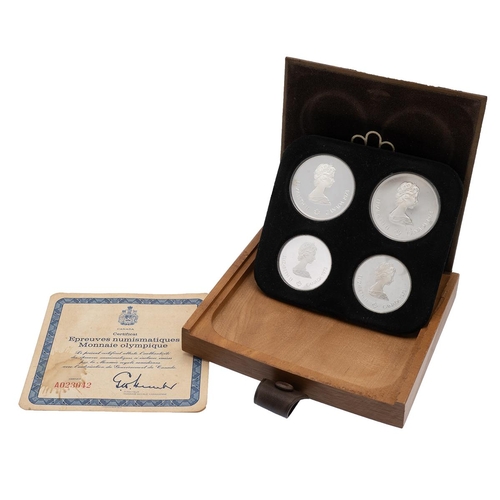 339 - 1973 Canada Montreal Olympics 4-coin silver proof set in the original wooden box. Includes (1) 1973 ... 