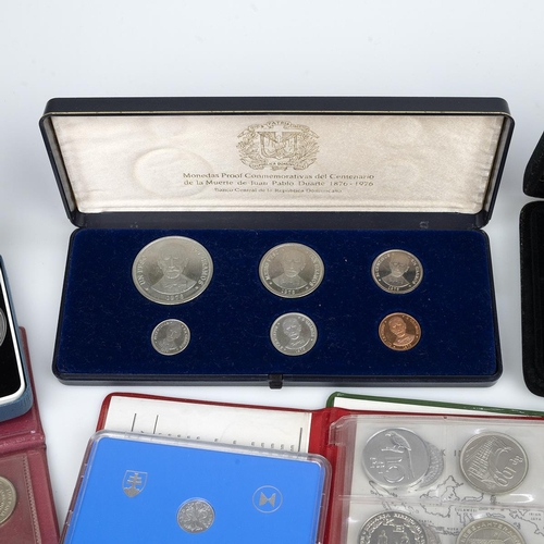 390 - Fourteen (14) world proof and uncirculated sets. Includes (1) 1967 Brazil Cruzeiro Novo seven-coin s... 