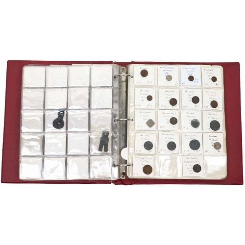 392 - Large folder of 19th and 20th-century coins and tokens in base metal and silver. Includes coins from... 