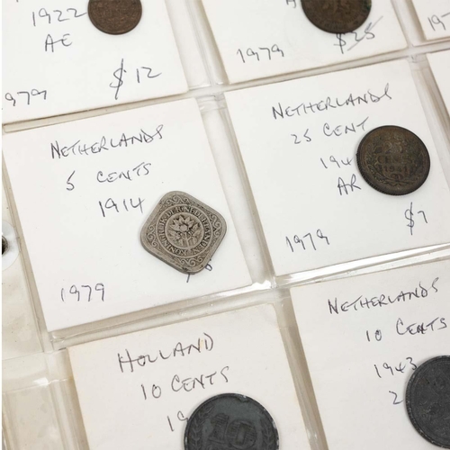 392 - Large folder of 19th and 20th-century coins and tokens in base metal and silver. Includes coins from... 