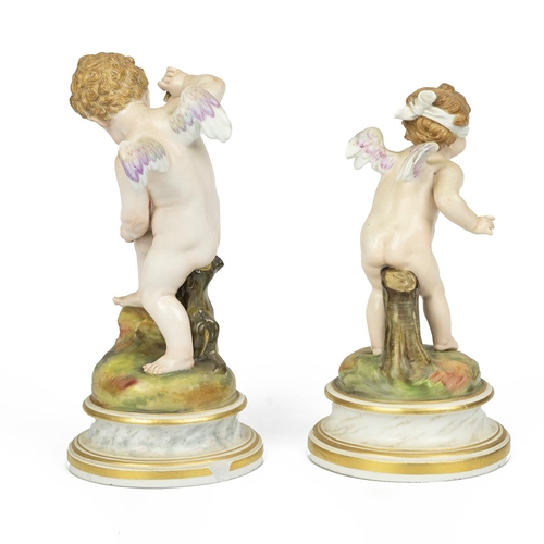 114 - Meissen - two 19th century cupids, one piercing a heart with an arrow (broken) (20cm) and the other ... 