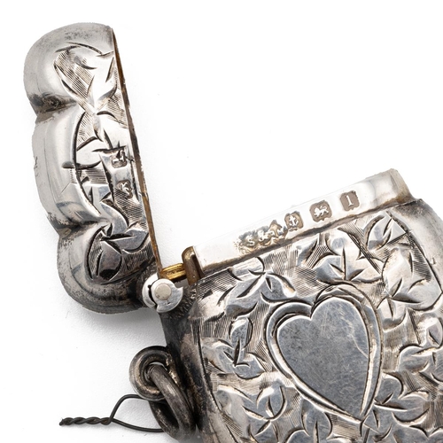 136 - Bright cut silver vesta case, with gilt interior, chased with vine leaves and a heart, Birmingham ha... 