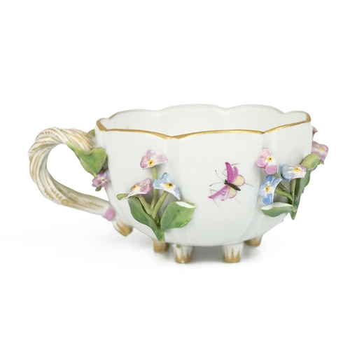 149 - A 19th Century Flowers and Bugs tea cup and saucer encrusted with flowers, bearing the Meissen cross... 