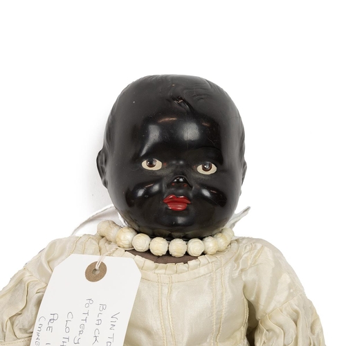 202 - Group of mid 20th Century dolls (5). 12 inch Pallitoy Trudy 3 face doll c1946; 15 inch black face do... 