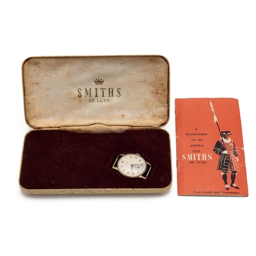 21 - Smiths De Luxe gentlemen's 9ct gold watch in the case with paperwork and with the original fitted ca... 